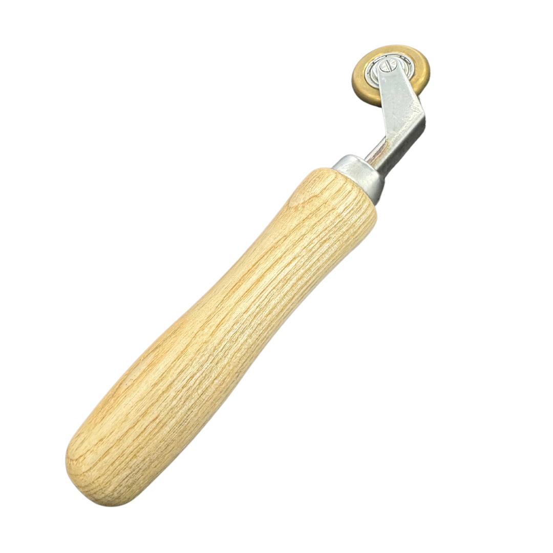 Forspec Penny Roller with wooden handle for applying pressure to waterproofing membranes, tapes and seam joints.