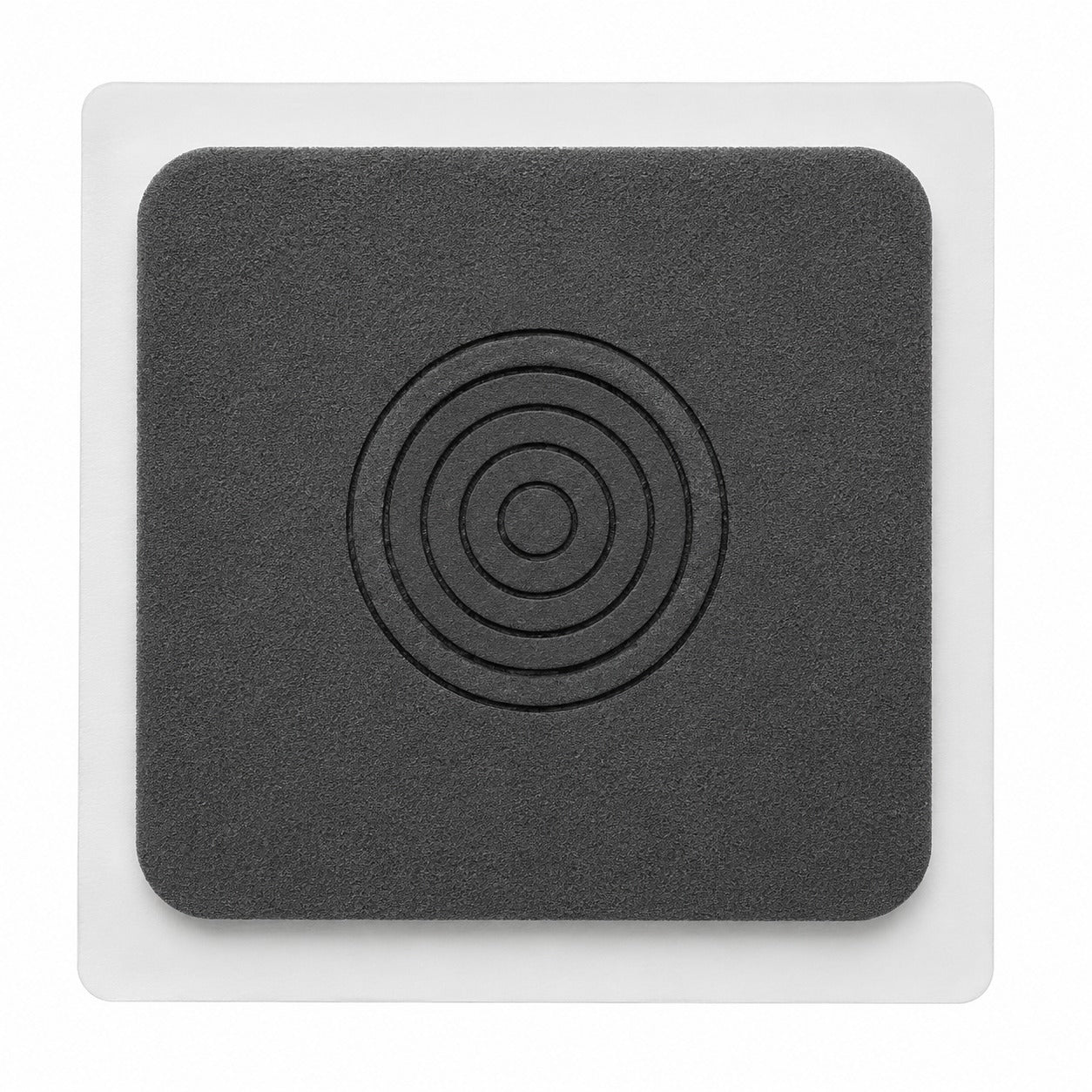 Square foam penetration seal with concentric cut rings for waterproofing pipe penetrations and service outlets.