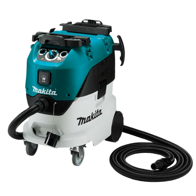 Makita VC4210L 1200W industrial wet and dry vacuum cleaner with automatic filter cleaning, dust extraction hose, and 42L capacity for construction and workshop applications.