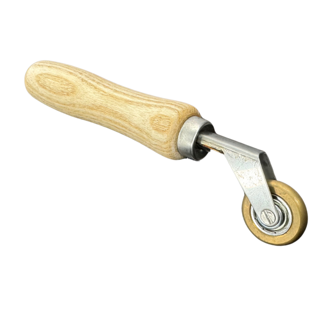 Forspec Penny Roller with wooden handle for applying pressure to waterproofing membranes, tapes and seam joints.