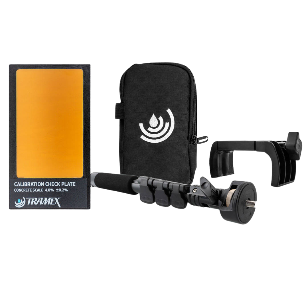 Tramex accessory pack for CME5 and CMEX5 moisture meters, including calibration check plate, protective carry case, extension handle and wall bracket for accurate moisture testing and equipment storage.